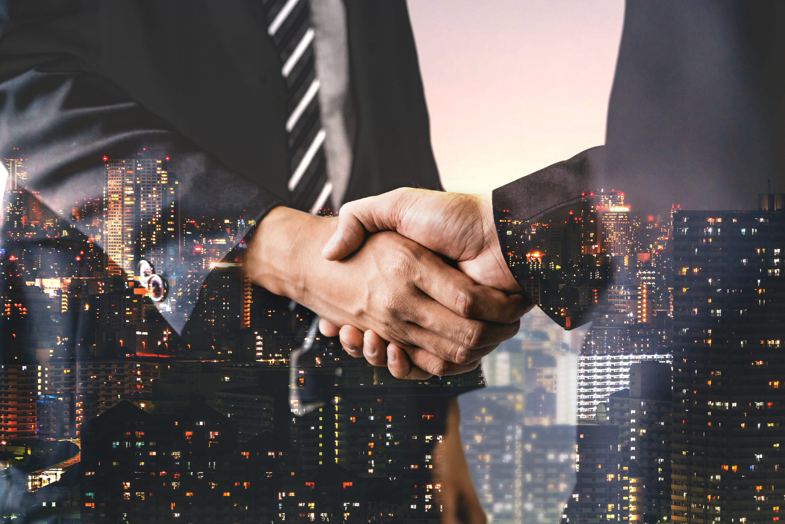 Double Exposure Image of Business People Handshake
